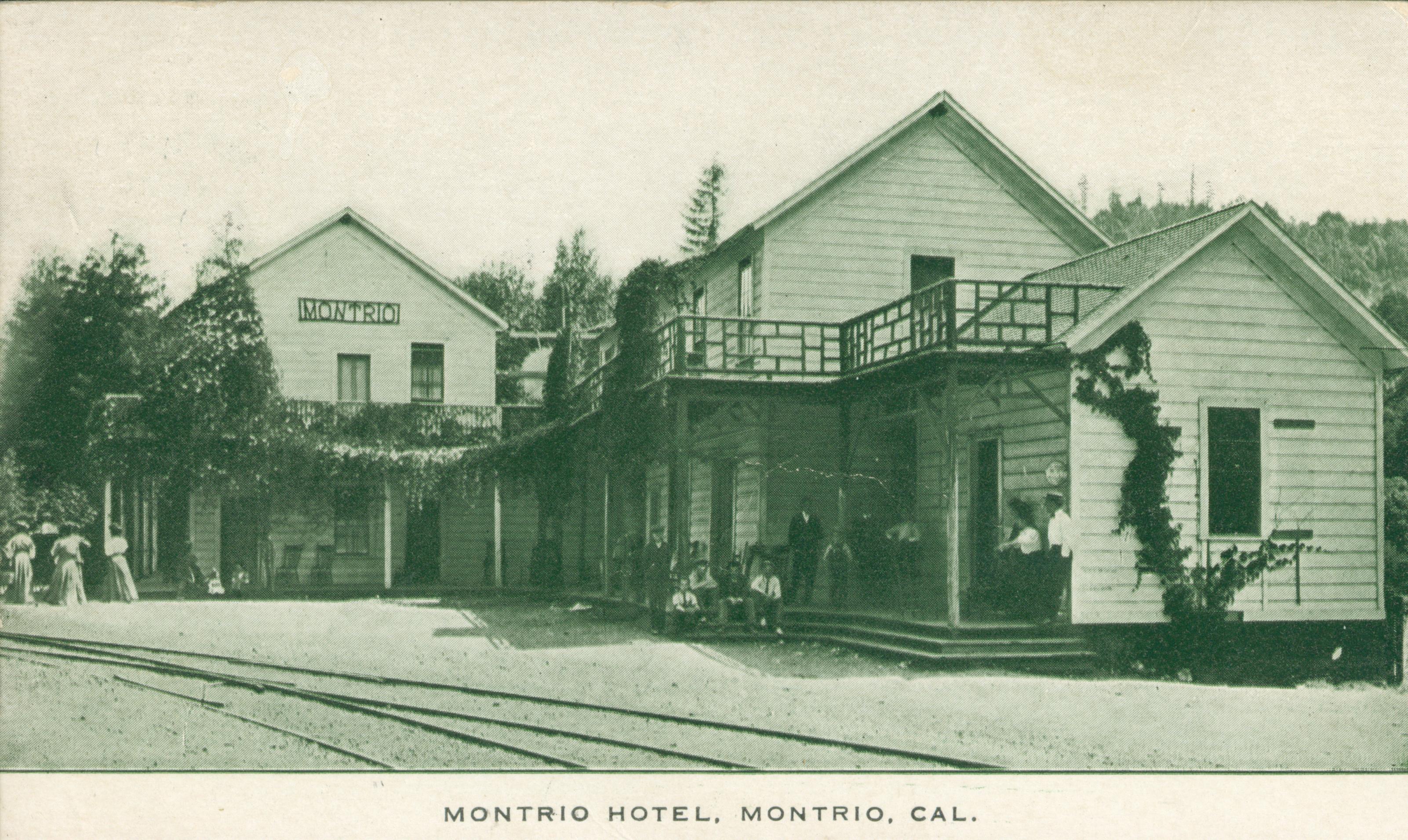 Shows a view of the Montrio Hotel with several people seated on the porch.